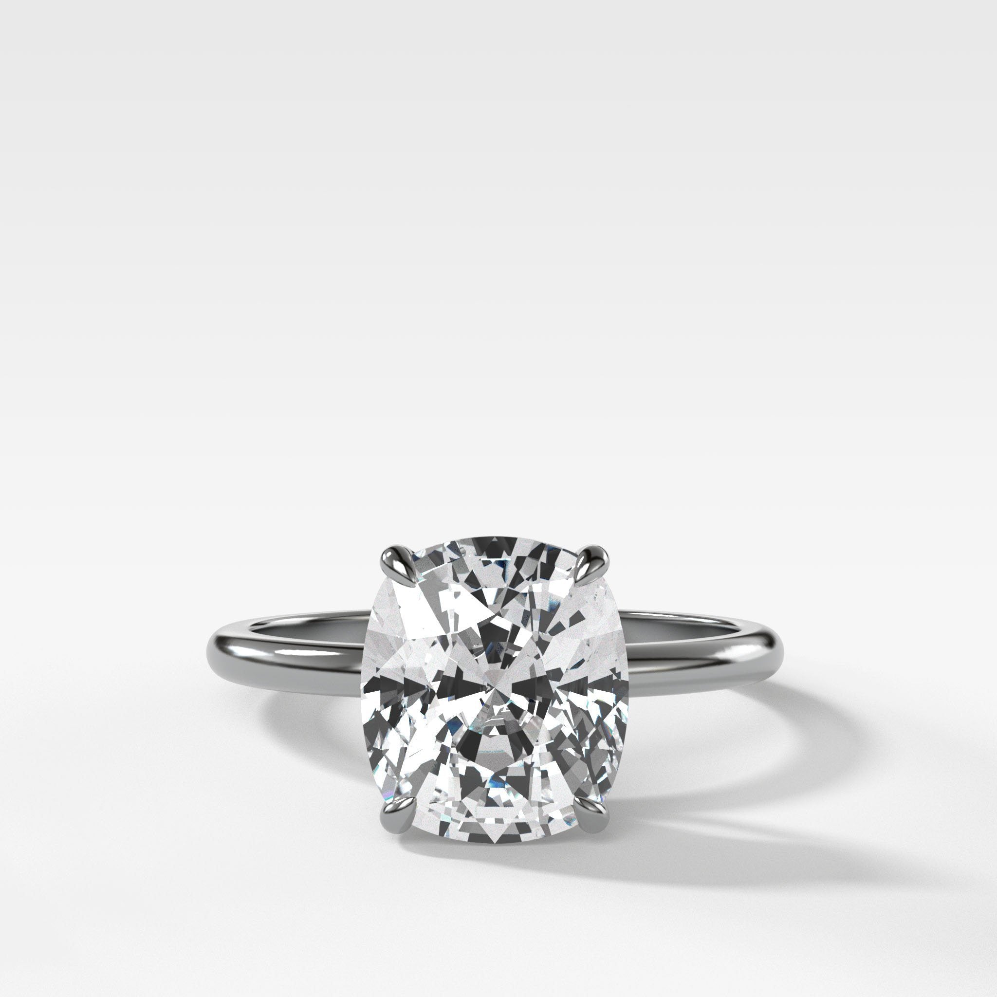Thin + Simple Solitaire Engagement Ring With Elongated Cushion Cut Diamond
