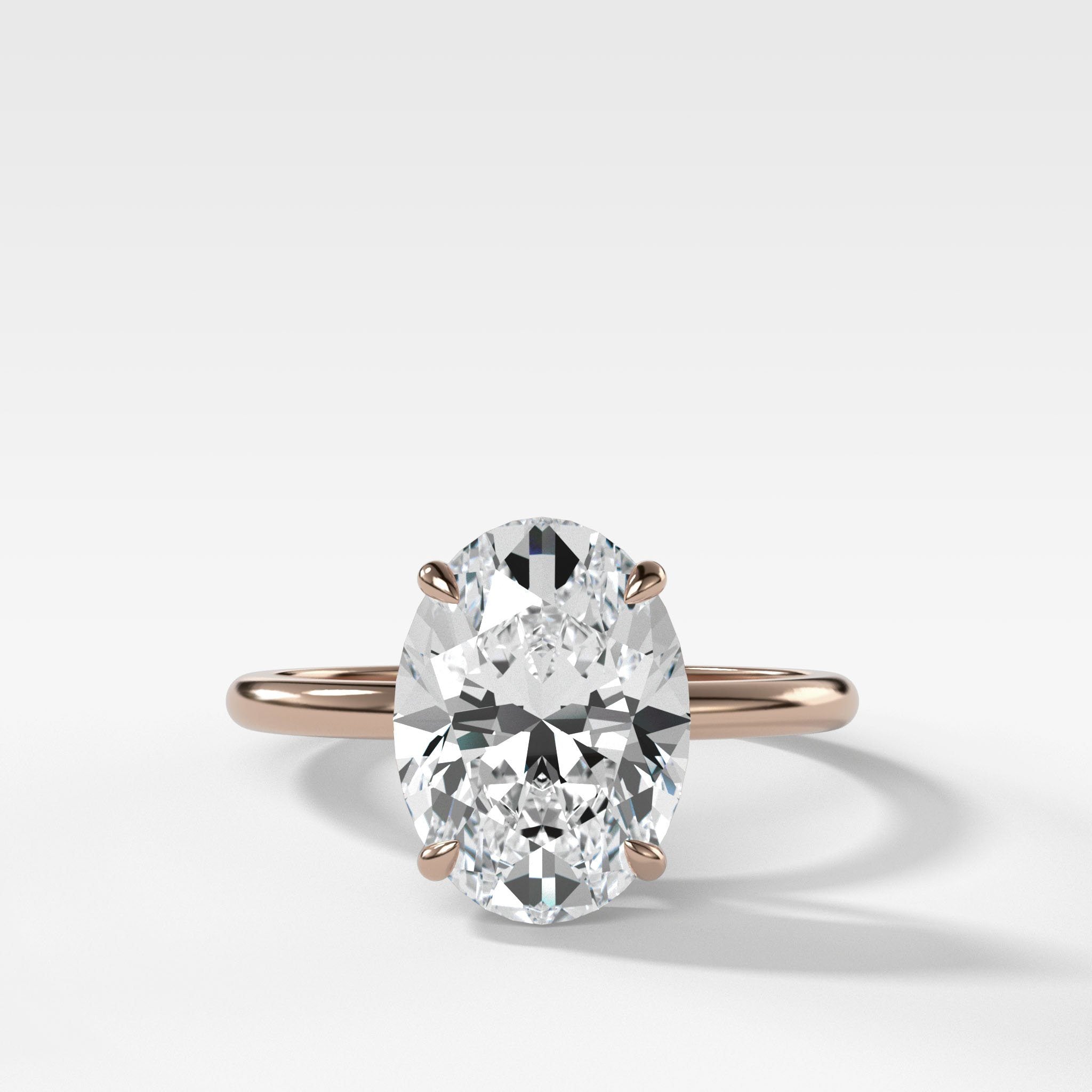 Thin + Simple Solitaire Engagement Ring With Oval Cut Diamond