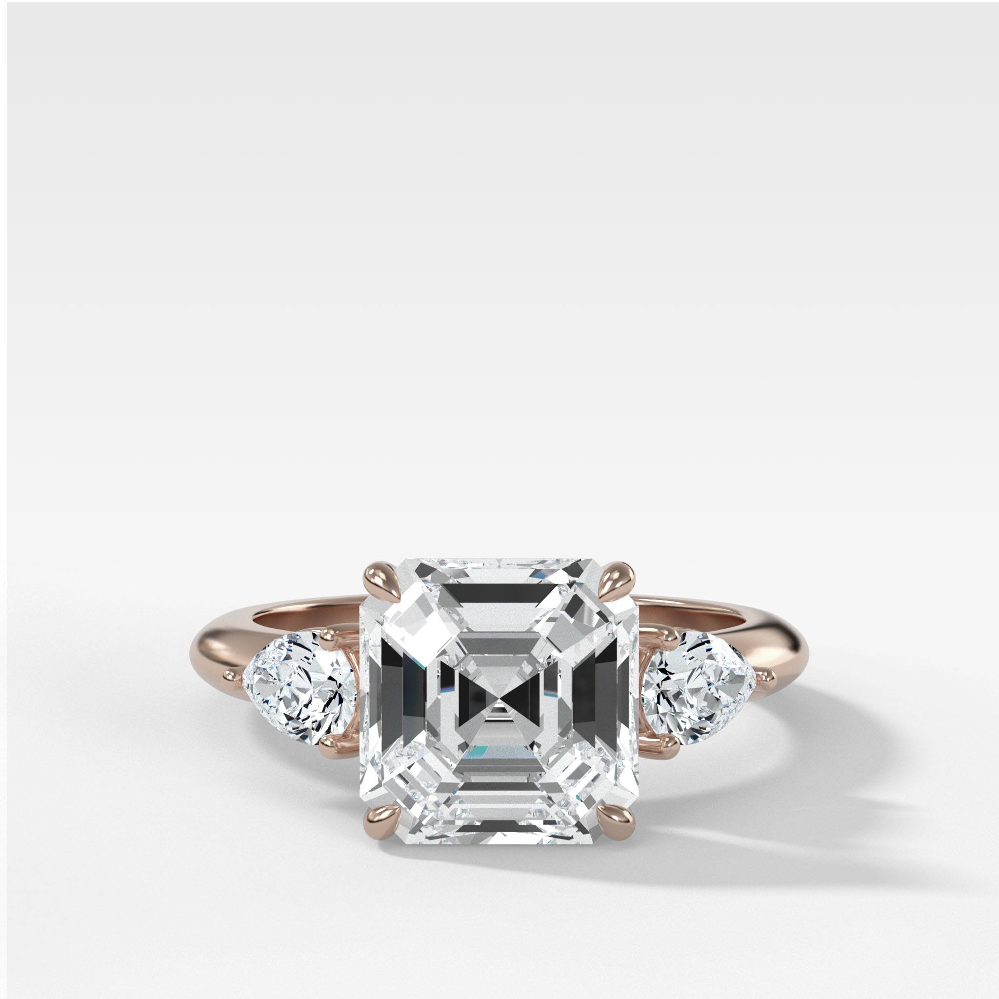 Three Stone Engagement Ring With Pear Side Stones and Asscher Cut Diamond