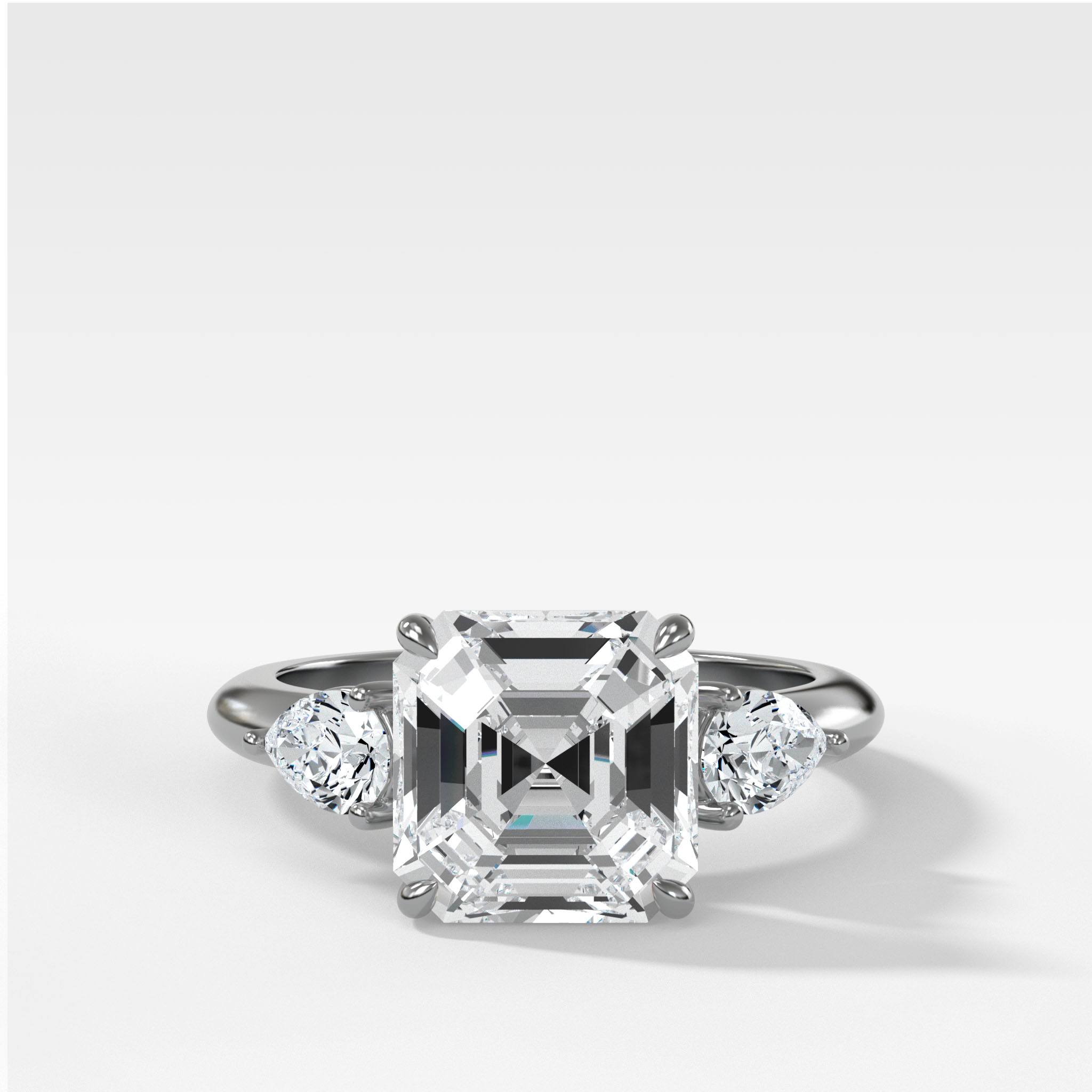 Three Stone Engagement Ring With Pear Side Stones and Asscher Cut Diamond