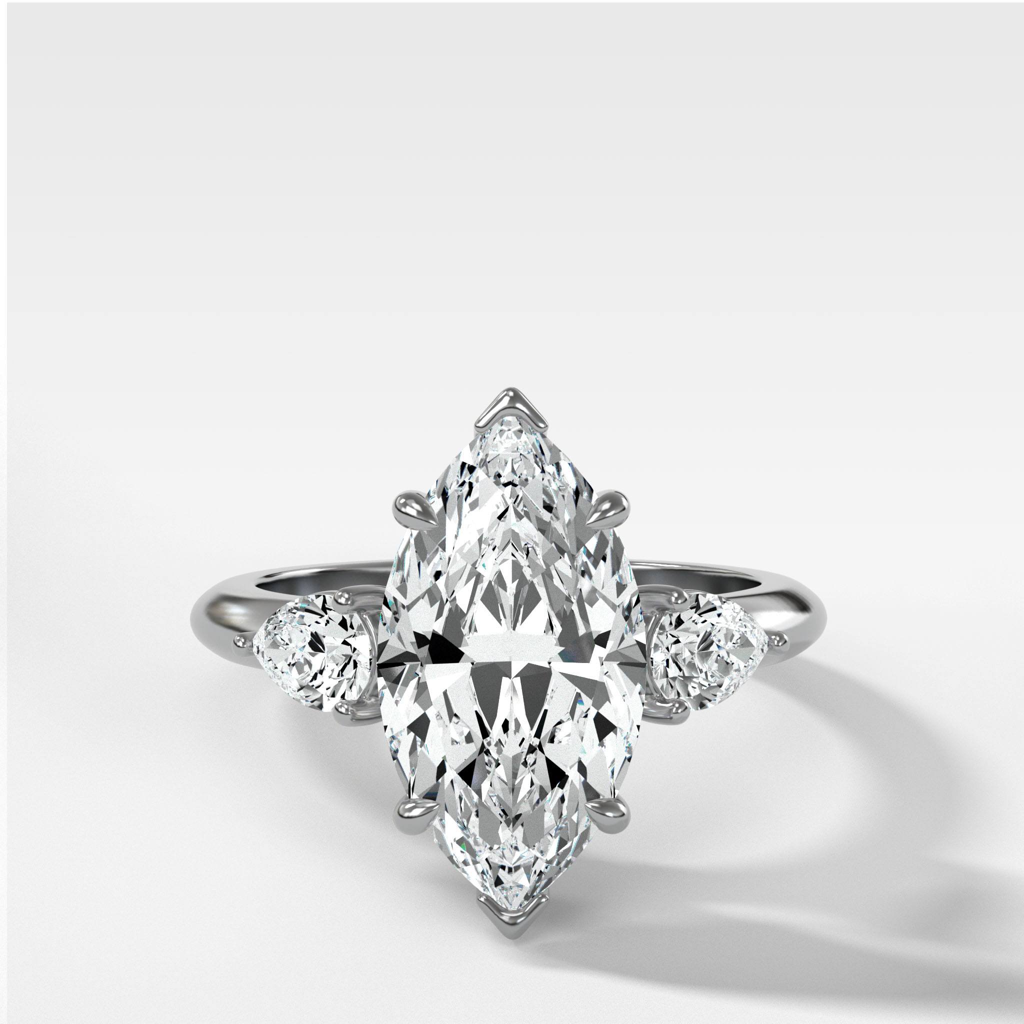 Three Stone Engagement Ring With Pear Side Stones and Marquise Cut Diamond