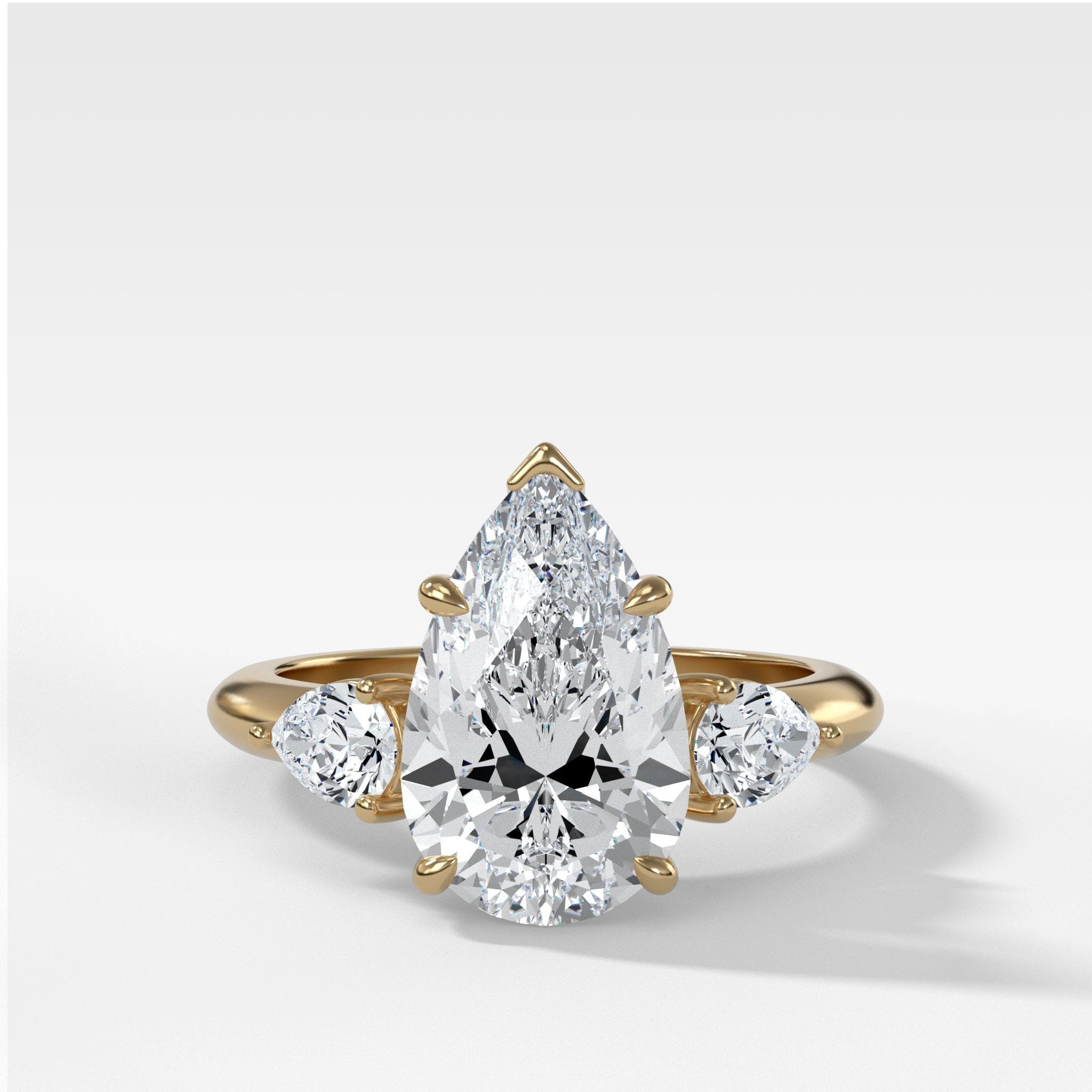 Three Stone Engagement Ring With Pear Side Stones and Pear Cut Diamond