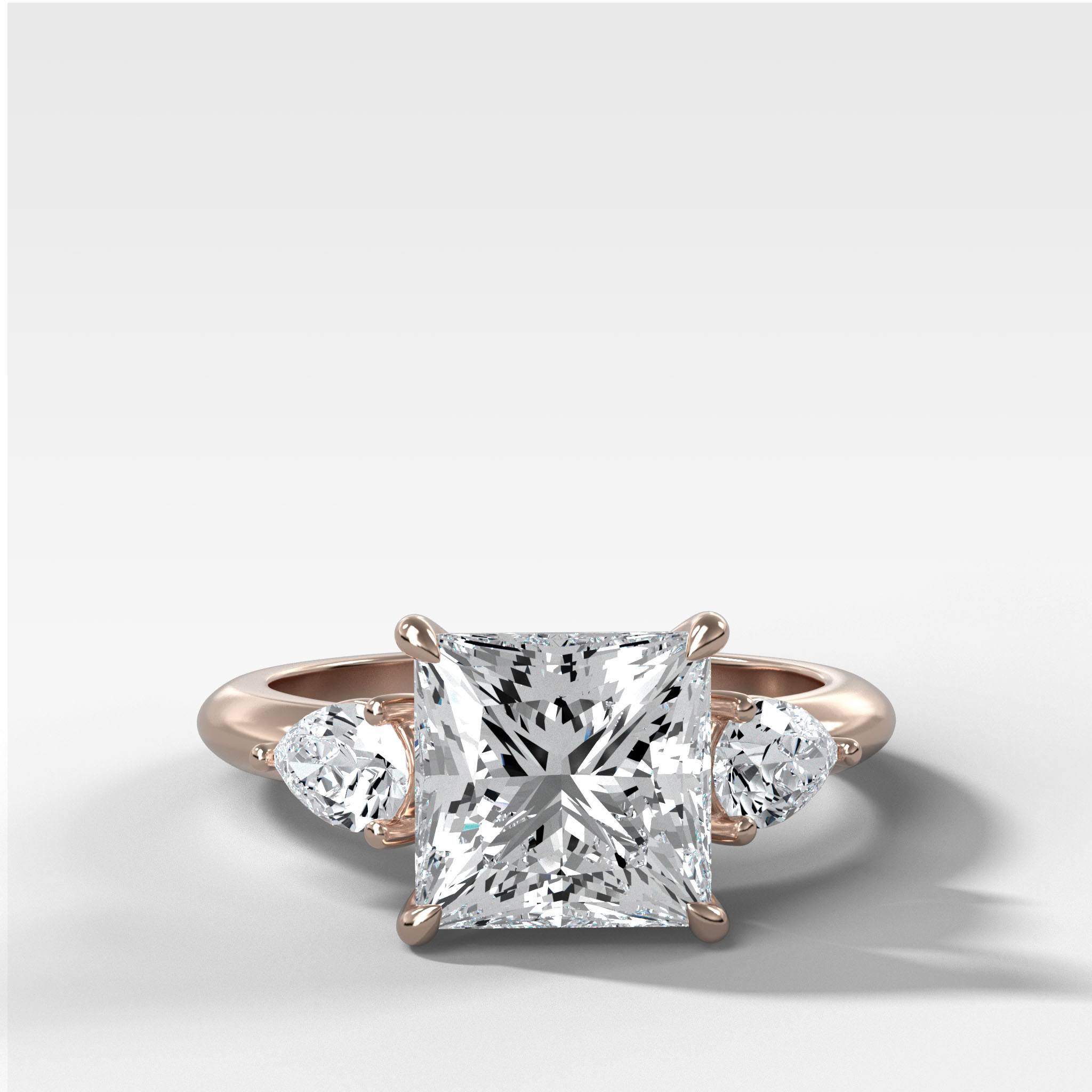Three Stone Engagement Ring With Pear Side Stones and Princess Cut Diamond