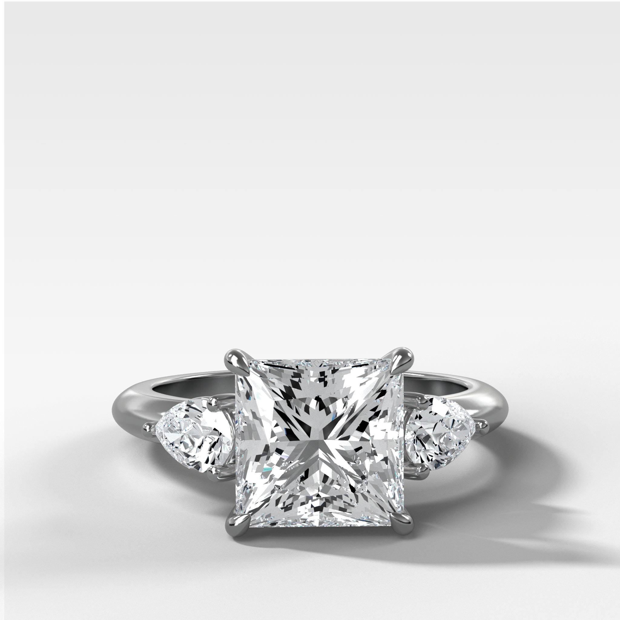 Three Stone Engagement Ring With Pear Side Stones and Princess Cut Diamond