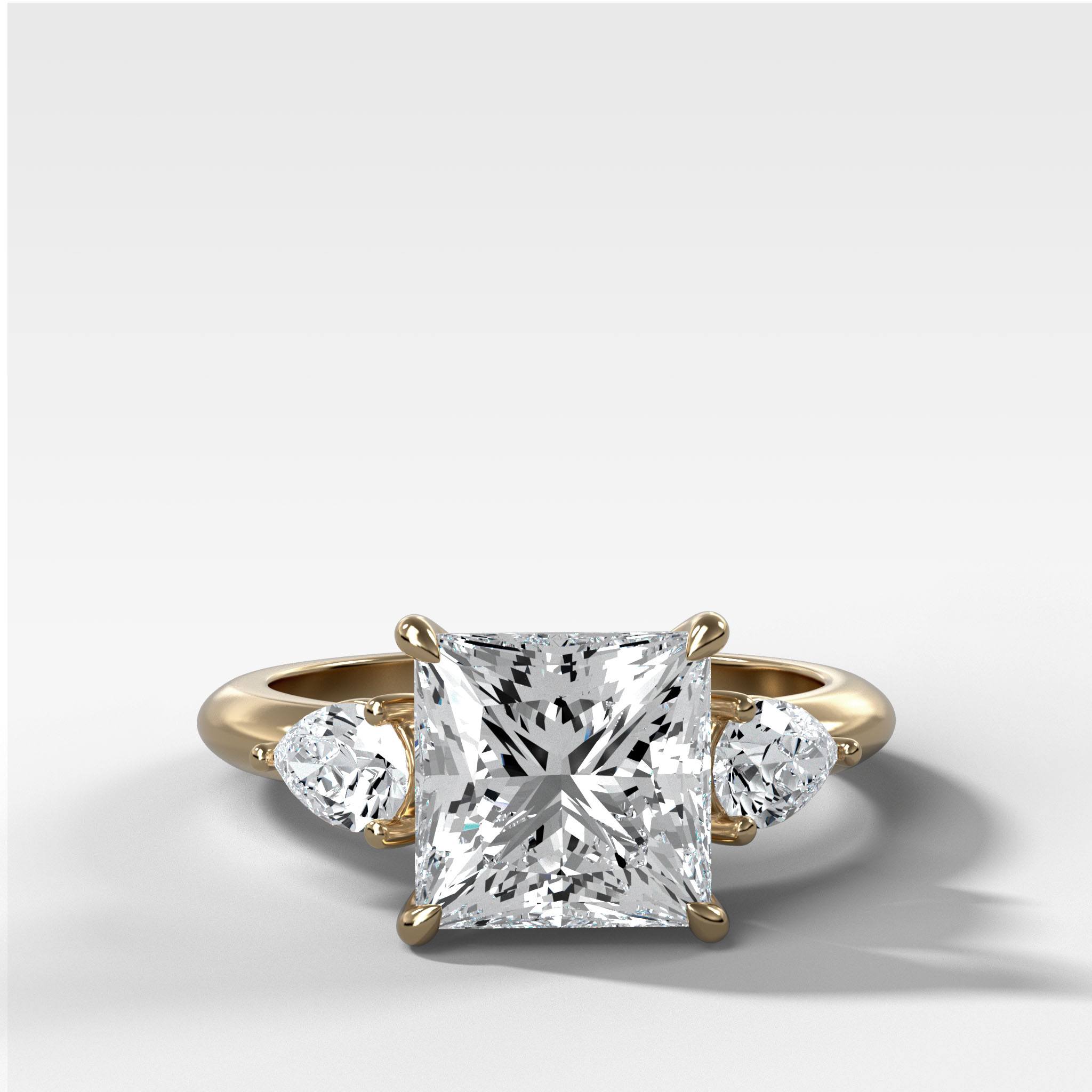 Three Stone Engagement Ring With Pear Side Stones and Princess Cut Diamond