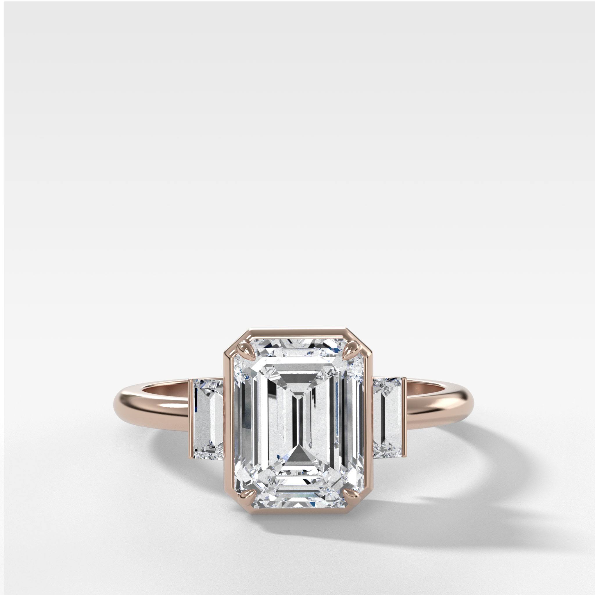 Three Stone Engagement Ring With Straight Baguette Side Stones and Emerald Cut Diamond