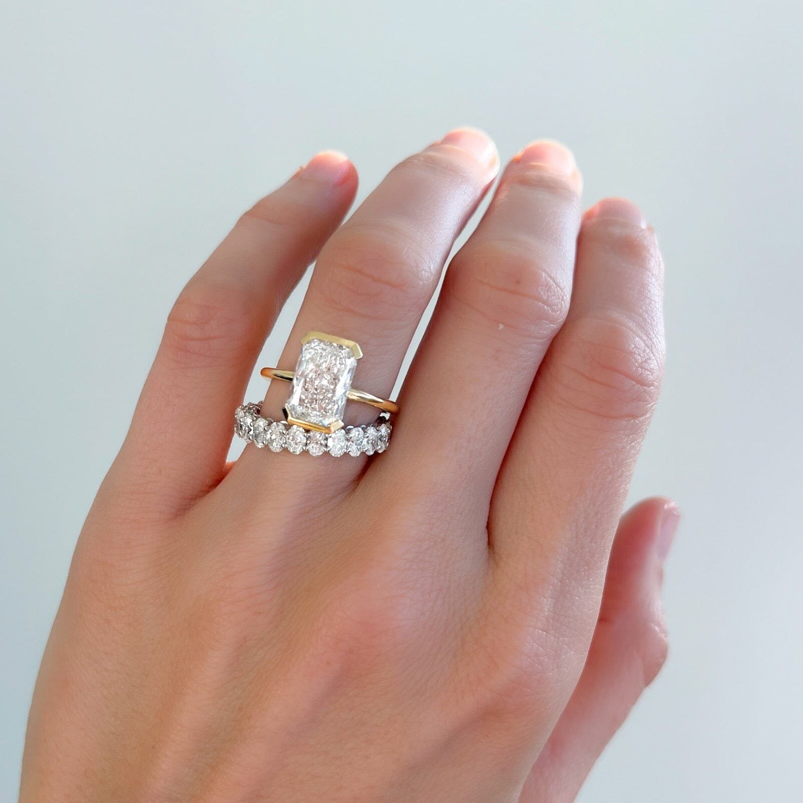 North South Half Bezel Solitaire Engagement Ring With Elongated Radiant Cut Diamond