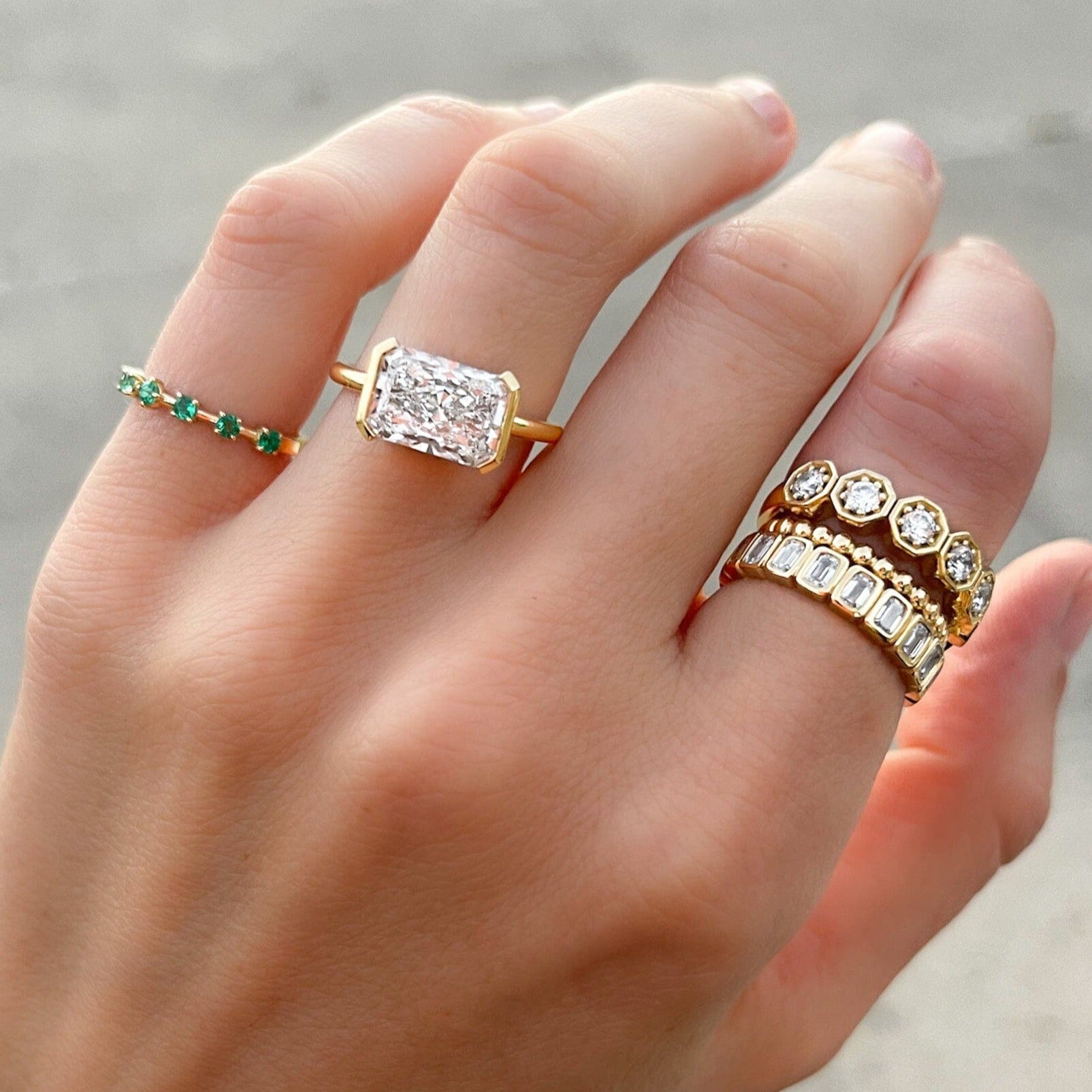 East West Half Bezel Solitaire Engagement Ring With Elongated Radiant Cut Diamond