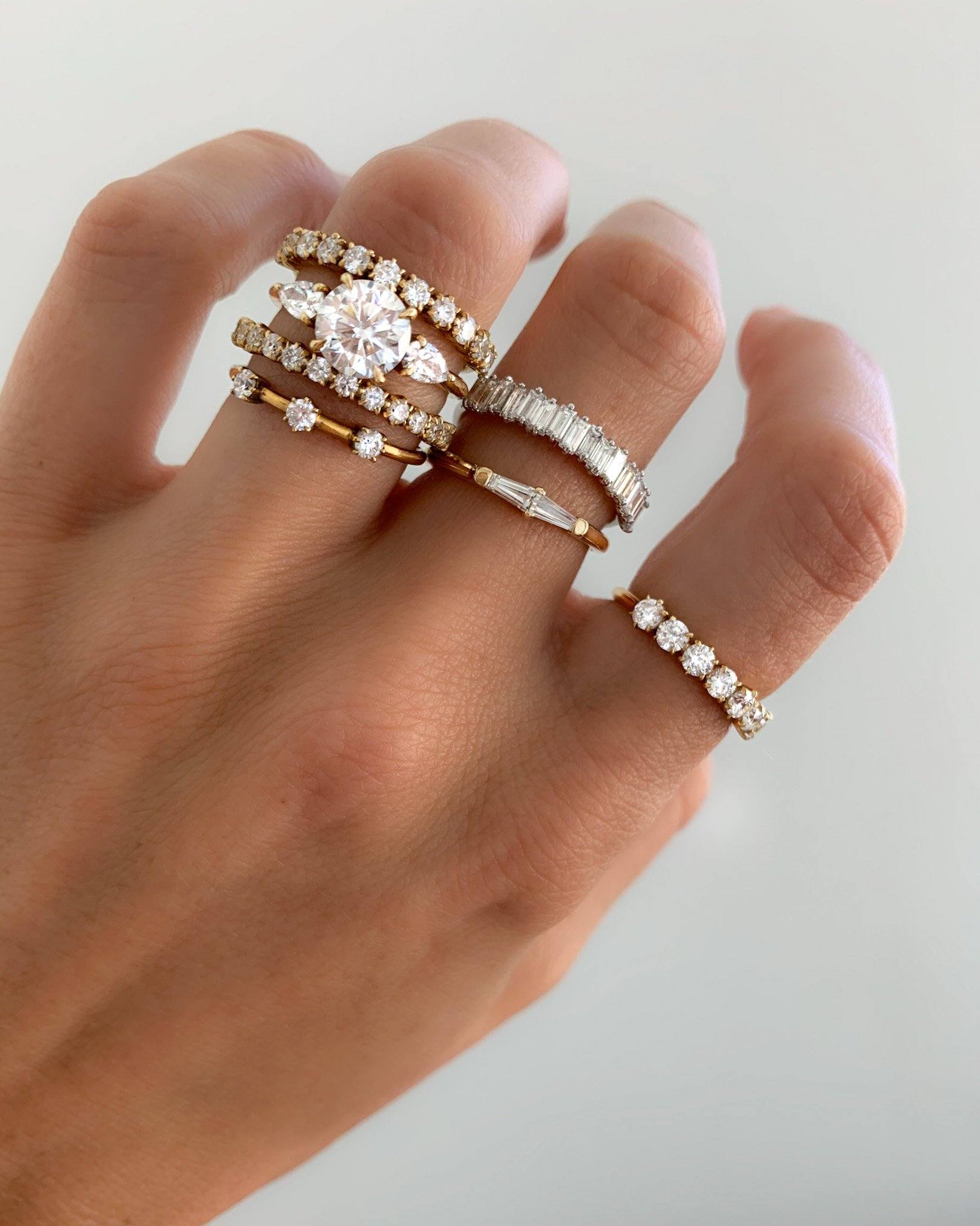 Three Stone Engagement Ring With Pear Side Stones With Round Cut Diamond