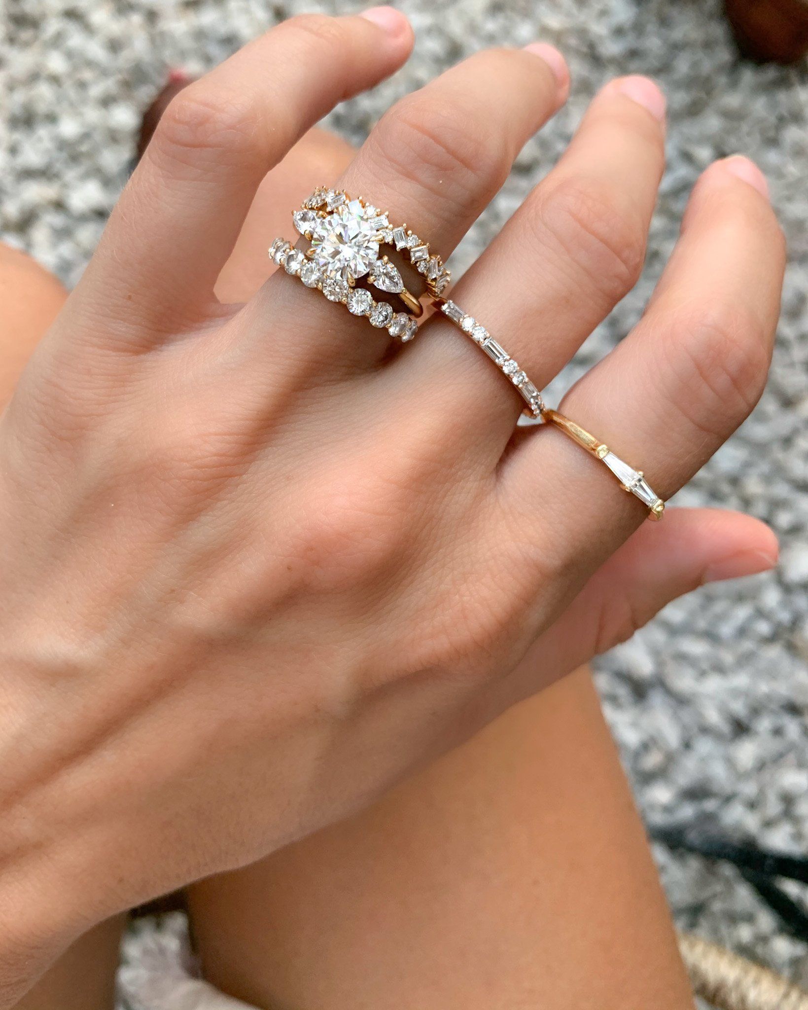 Three Stone Engagement Ring With Pear Side Stones With Round Cut Diamond