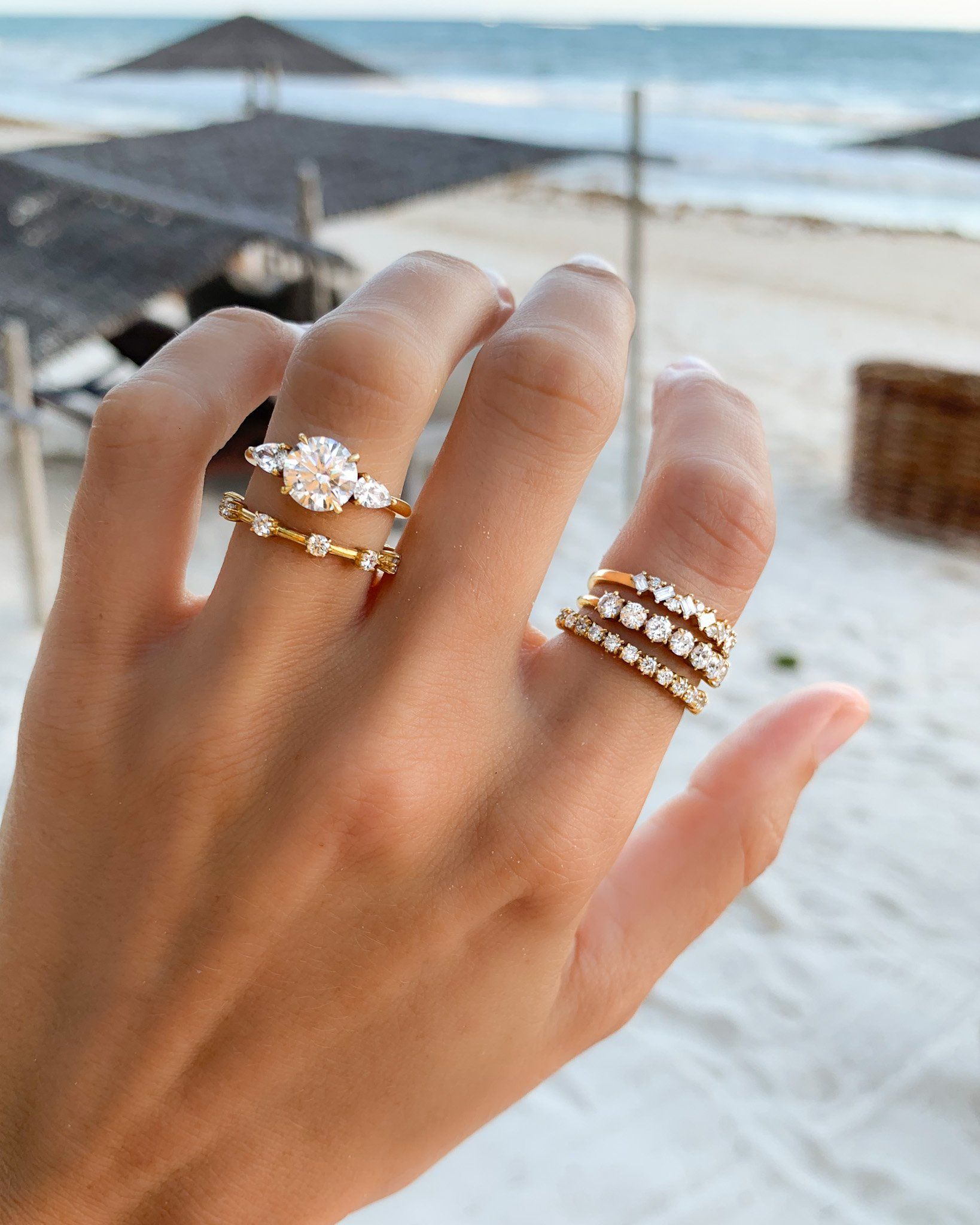 Three Stone Engagement Ring With Pear Side Stones With Round Cut Diamond