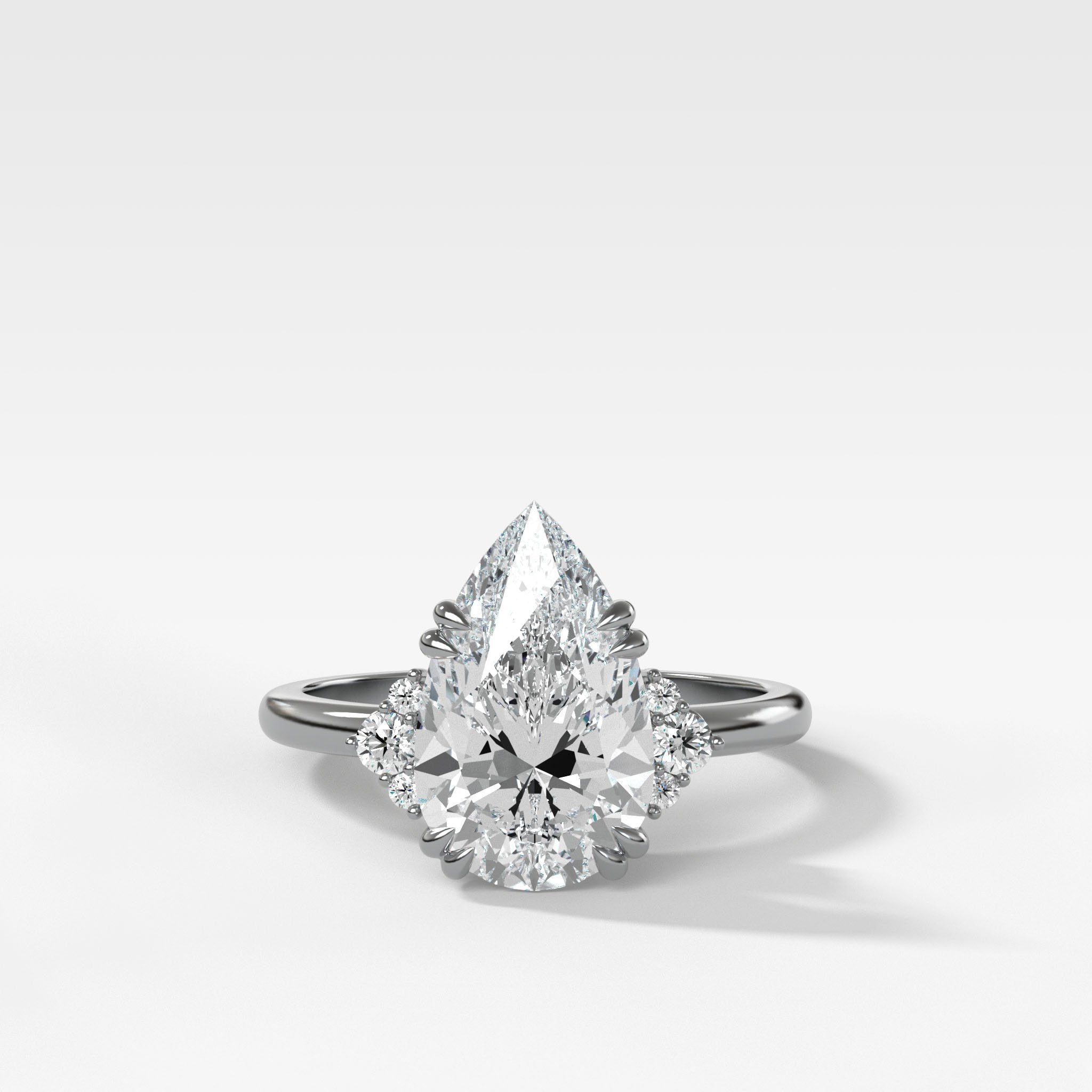 Signature Cluster Engagement Ring With Pear Cut Diamond