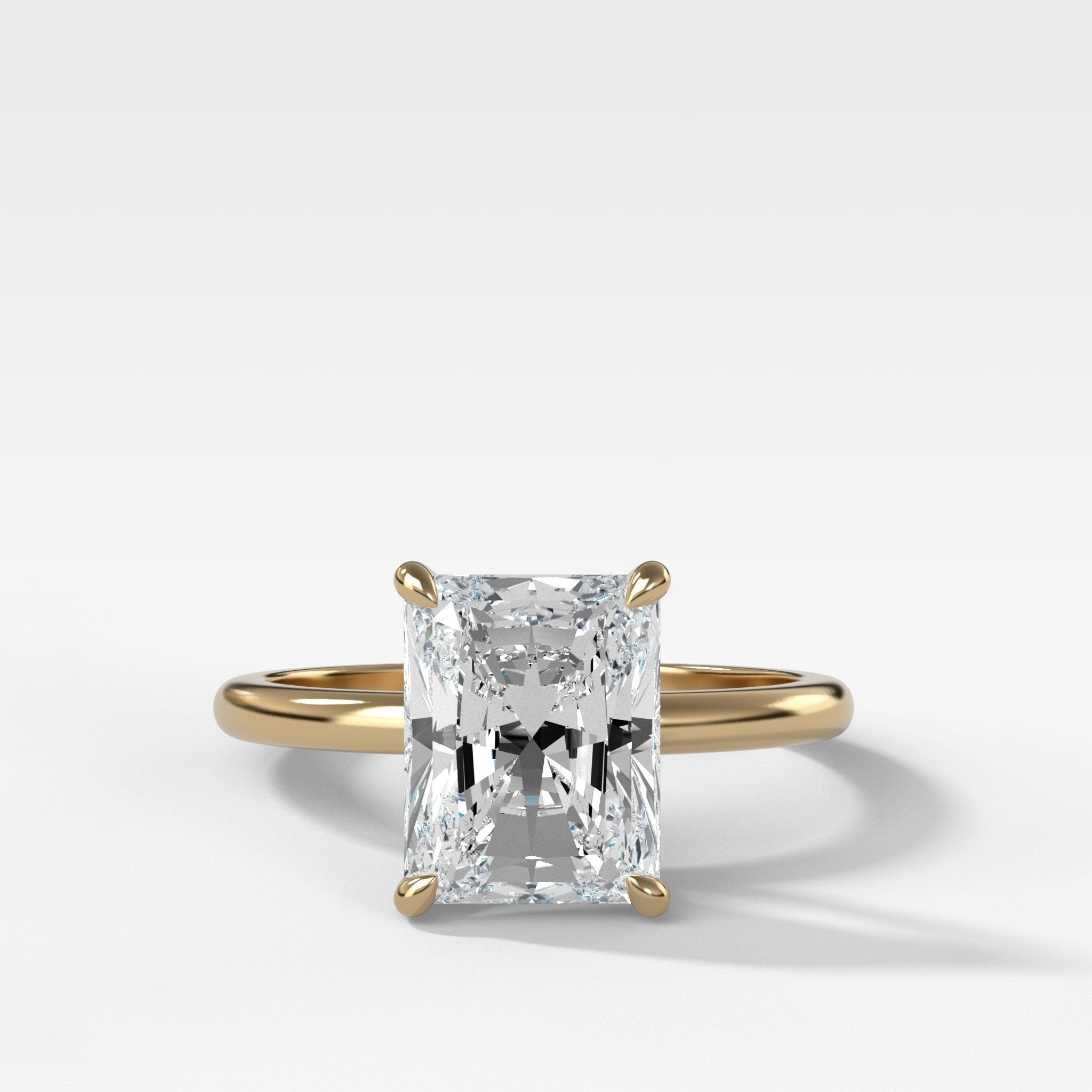Crescent Solitaire Engagement Ring With Elongated Radiant Cut Diamond