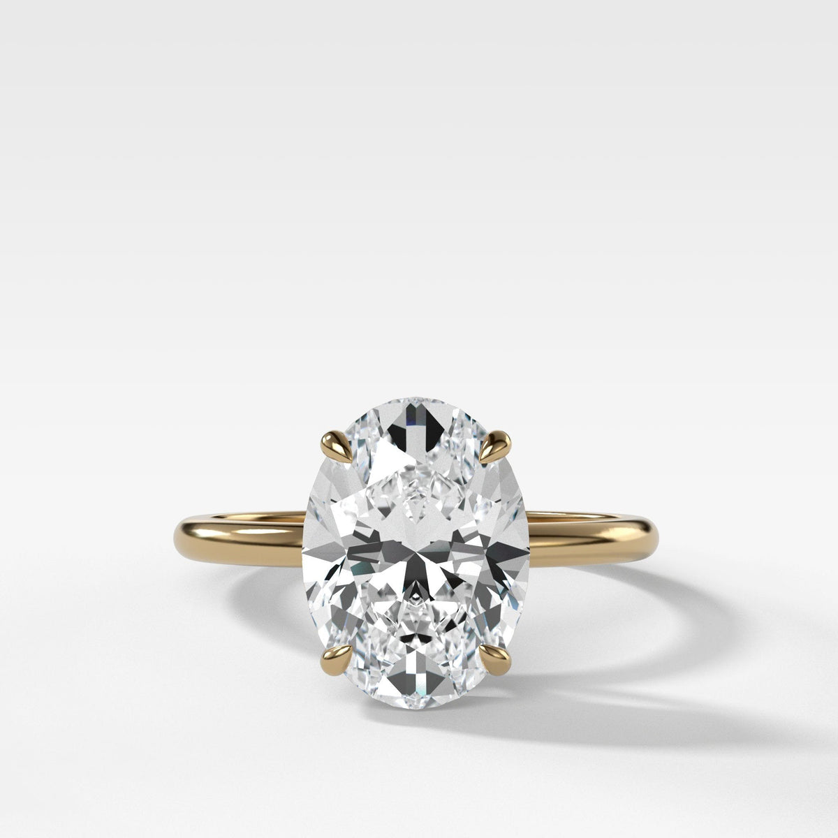 Thin + Simple Solitaire Engagement Ring With Oval Cut Diamond