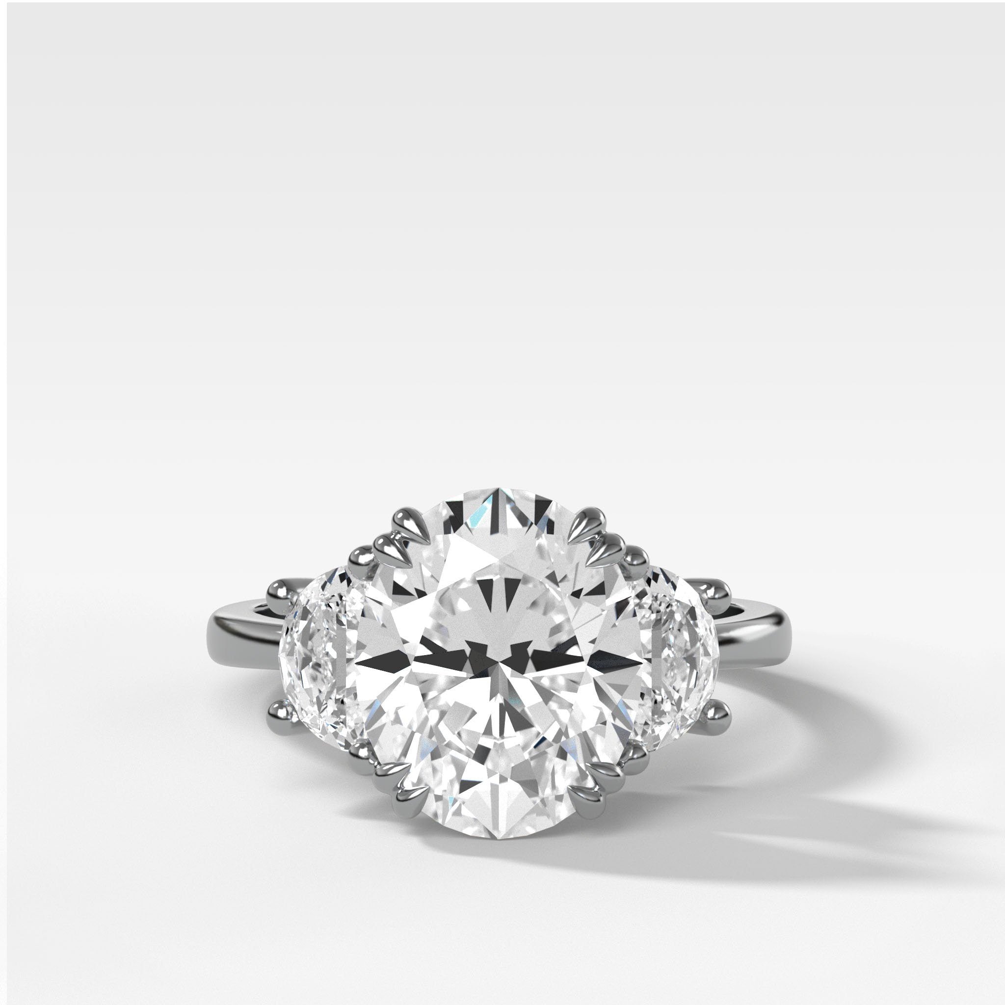 Oval Three Stone Engagement Ring With Half Moon Side Stones