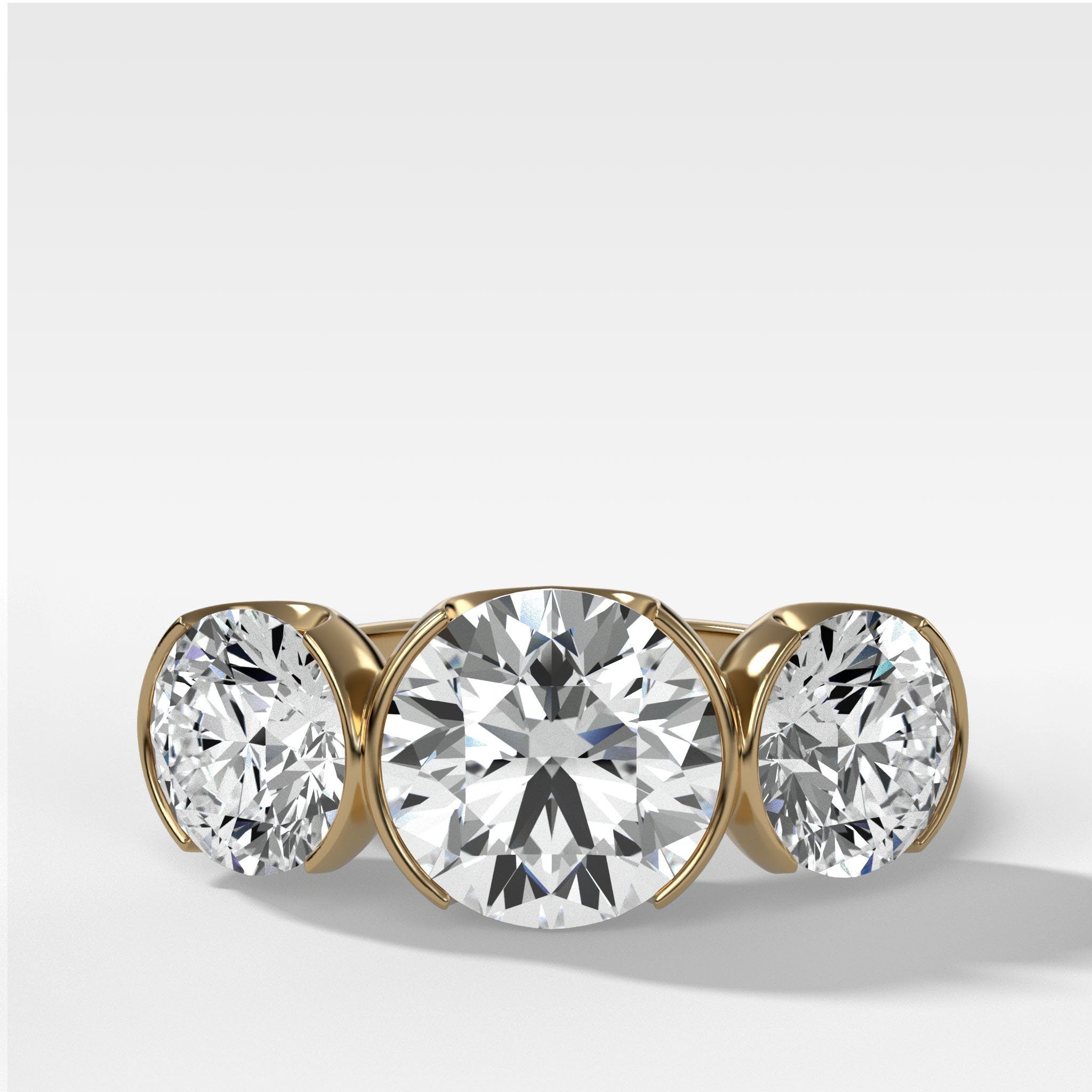 Half Bezel Triad Engagement Ring With Round Cut Diamonds