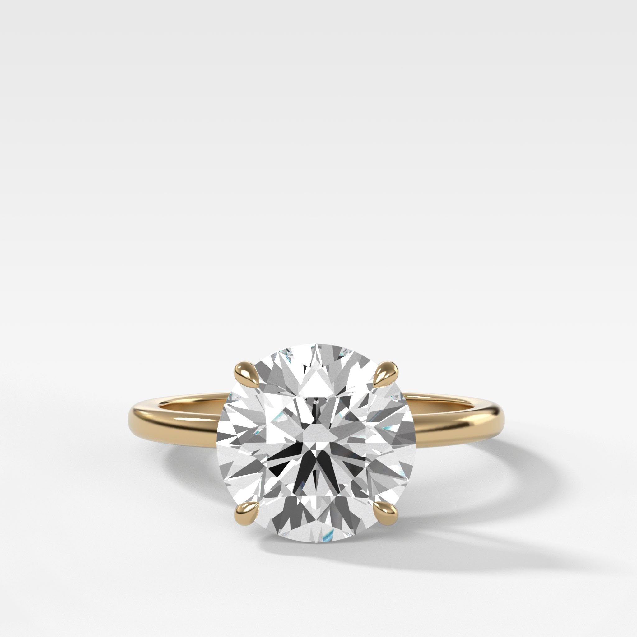 Crescent Solitaire Engagement Ring With Round Cut Diamond