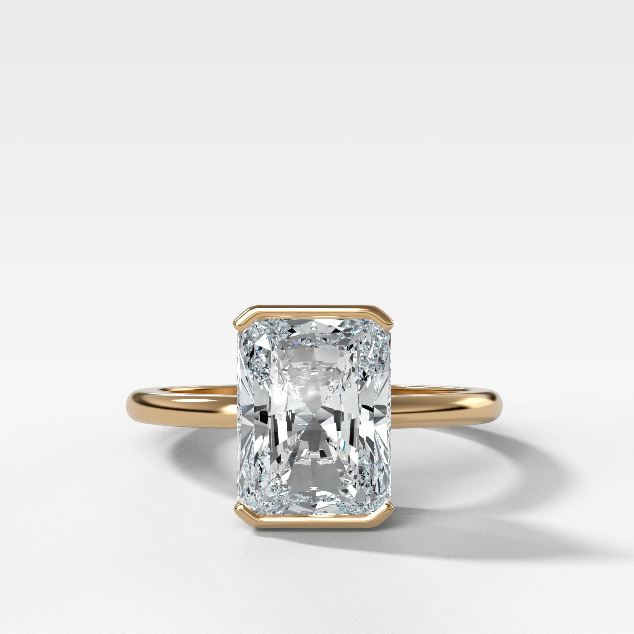 North South Half Bezel Solitaire Engagement Ring With Elongated Radiant Cut Diamond