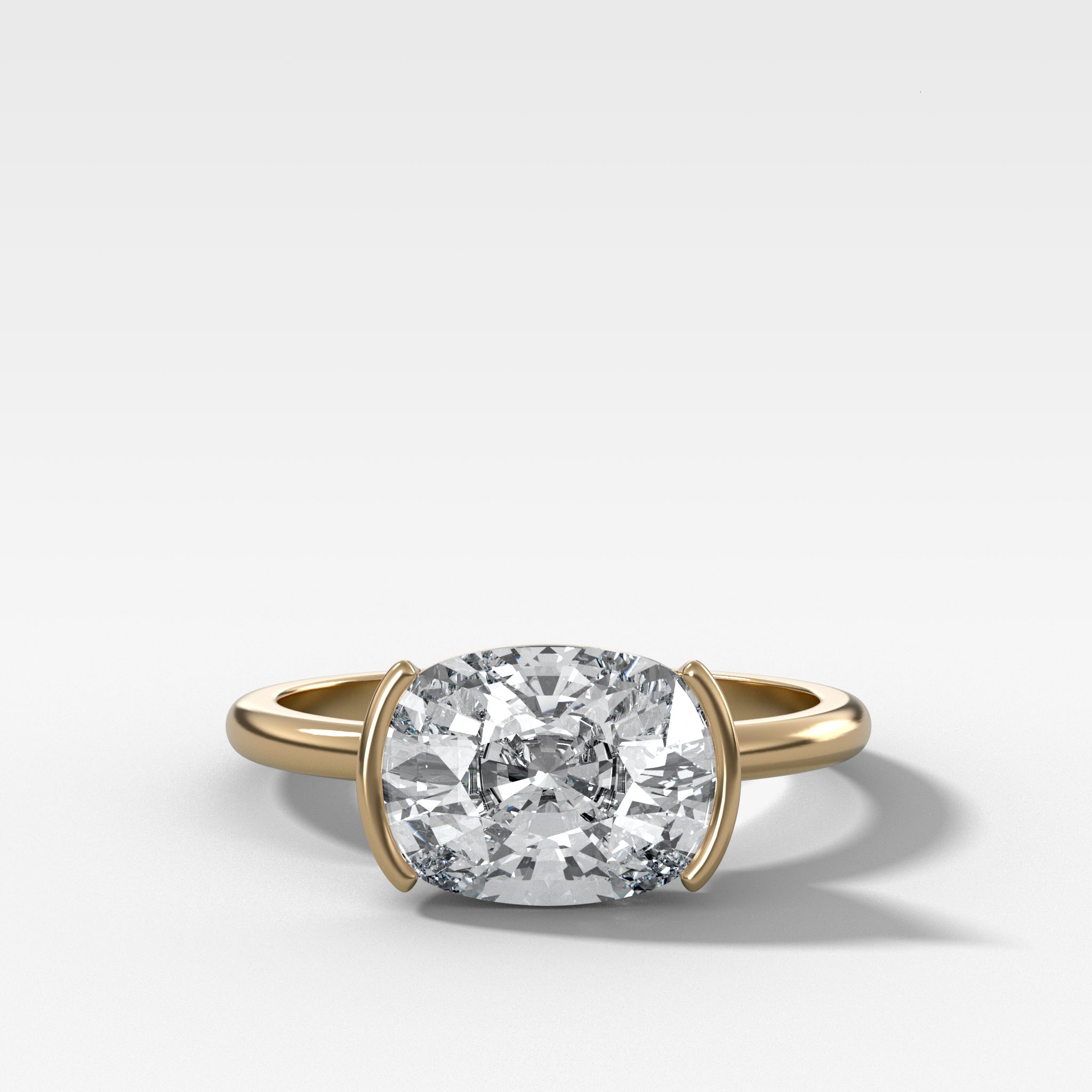 East West Half Bezel Solitaire Engagement Ring With Elongated Cushion Cut Diamond