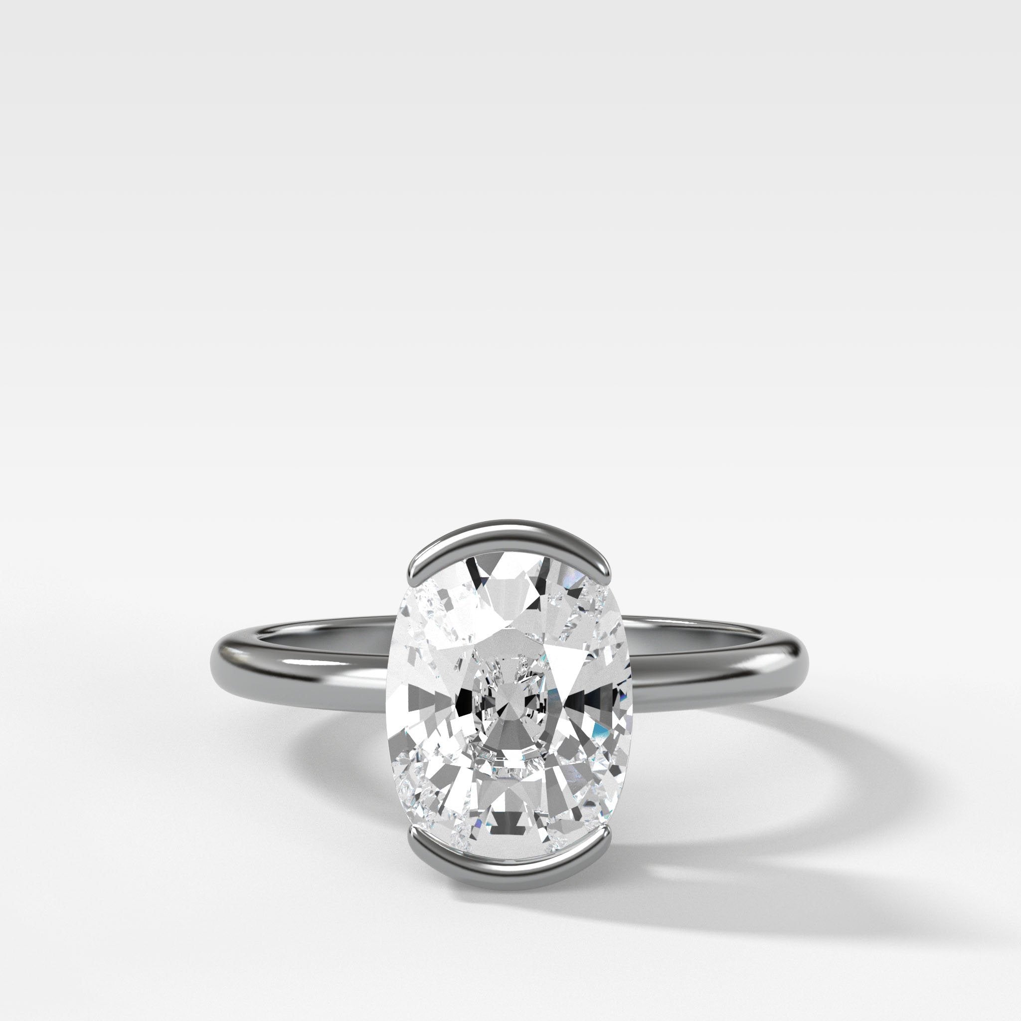 North South Half Bezel Solitaire Engagement Ring With Elongated Cushion Cut Diamond