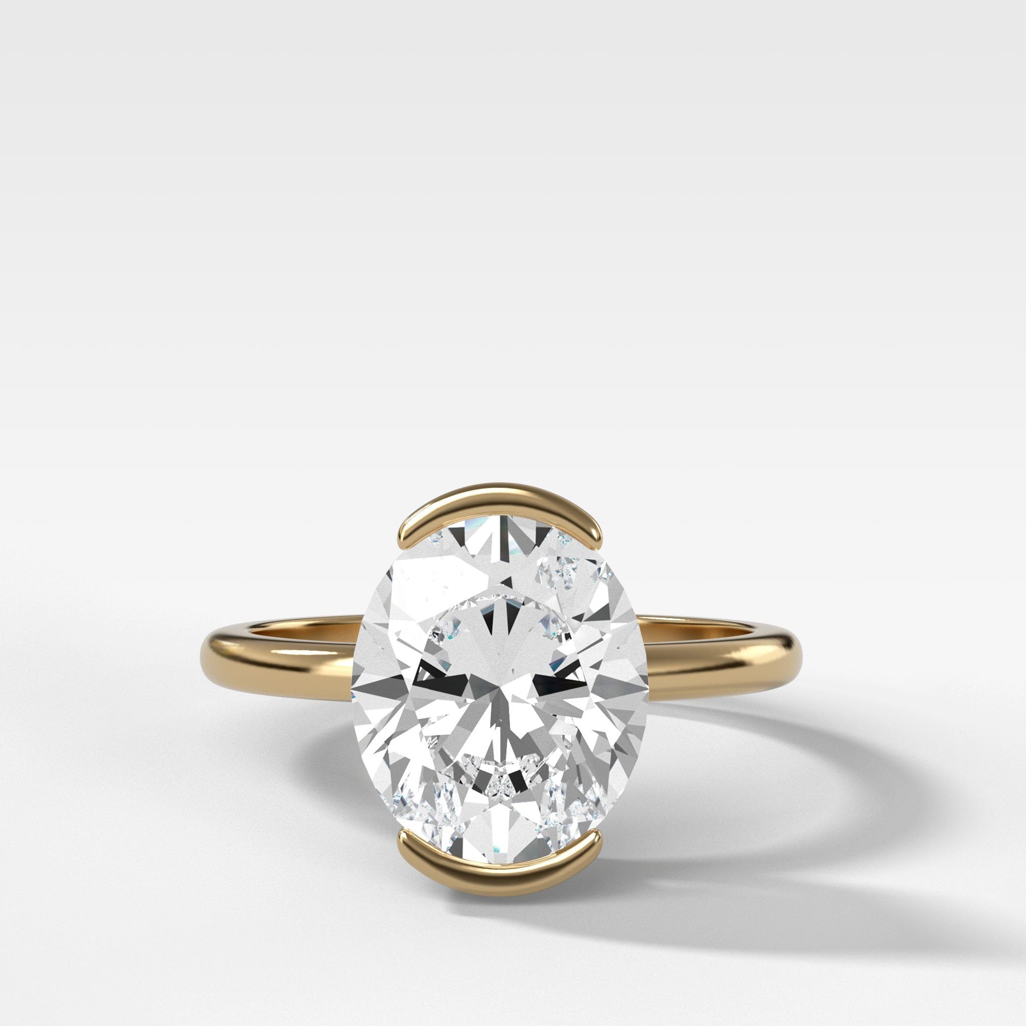 North South Half Bezel Solitaire Engagement Ring With Oval Cut Diamond