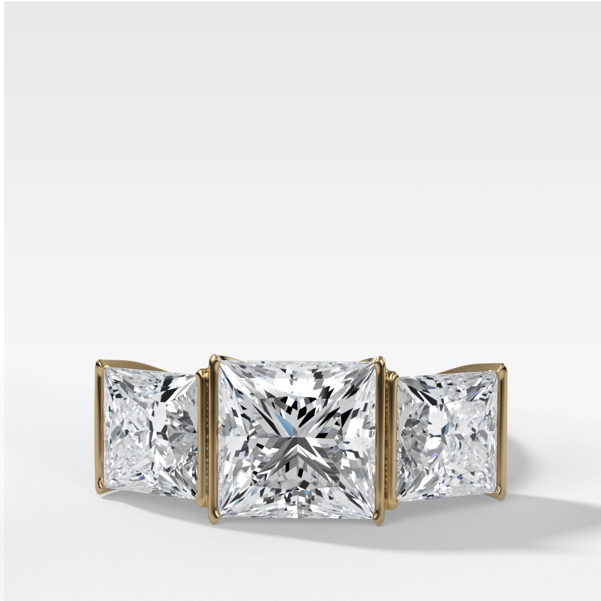 Half Bezel Triad Engagement Ring With Princess Cut Diamonds