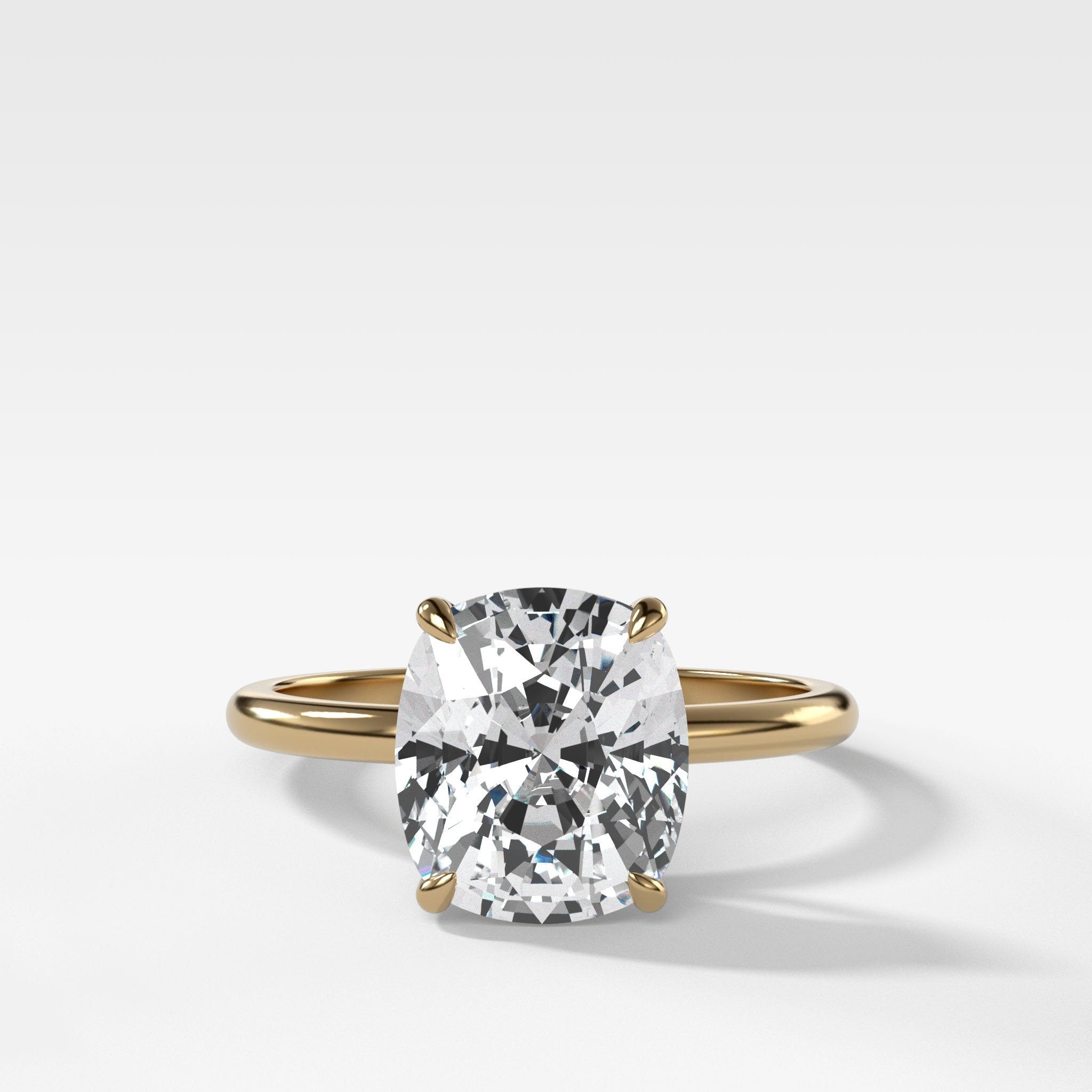 Thin + Simple Solitaire Engagement Ring With Elongated Cushion Cut Diamond