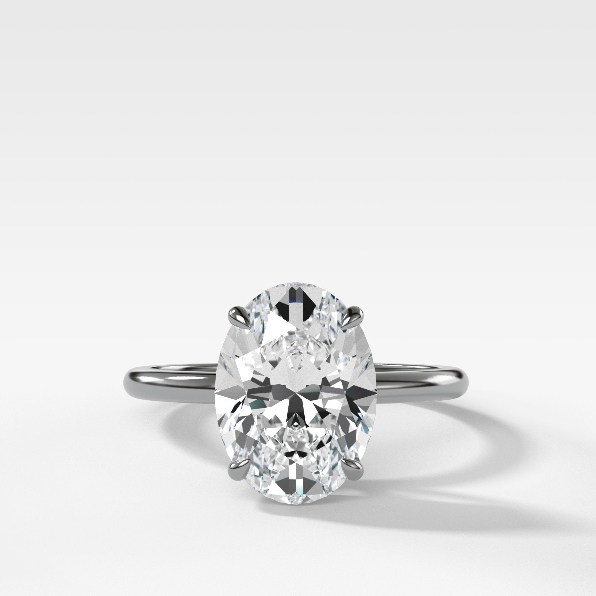 Thin + Simple Solitaire Engagement Ring With Oval Cut Diamond