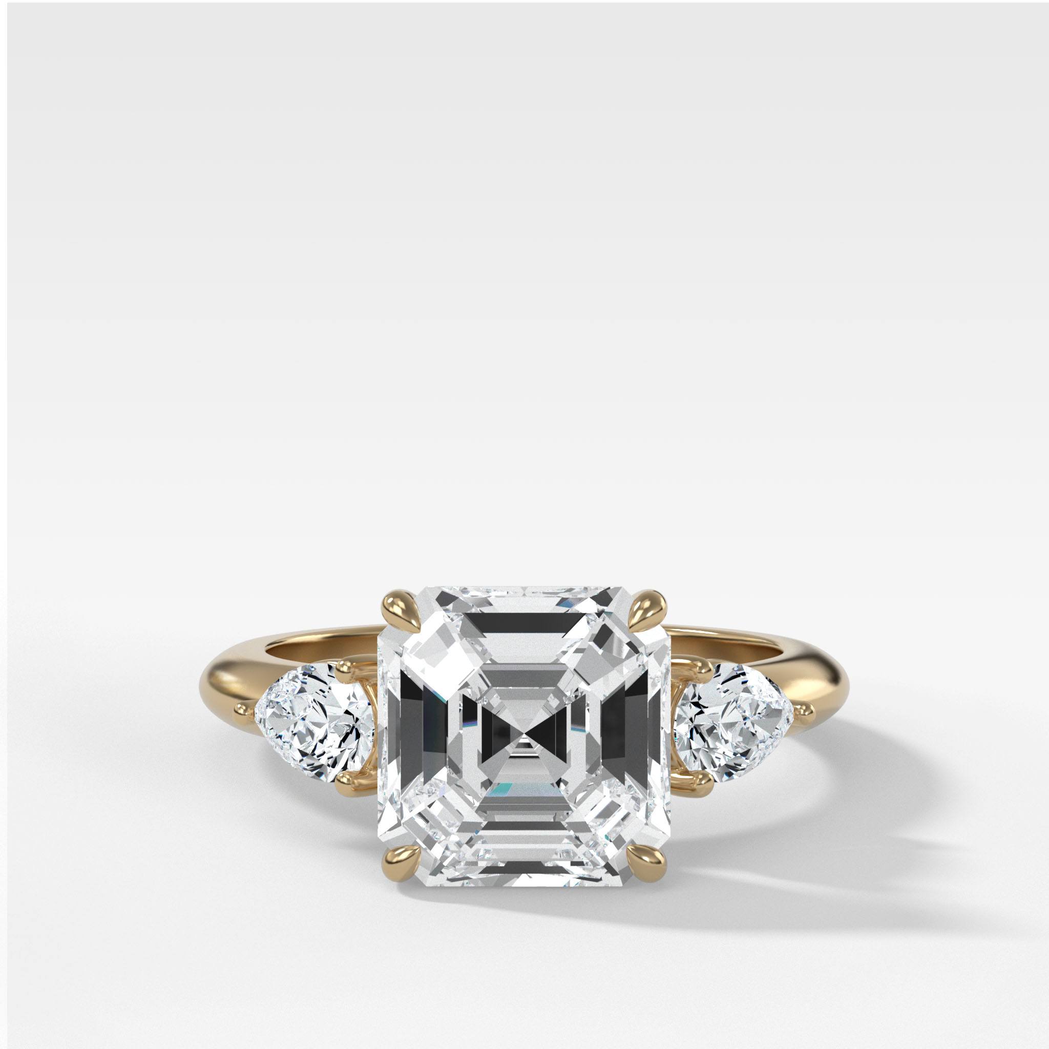 Three Stone Engagement Ring With Pear Side Stones and Asscher Cut Diamond