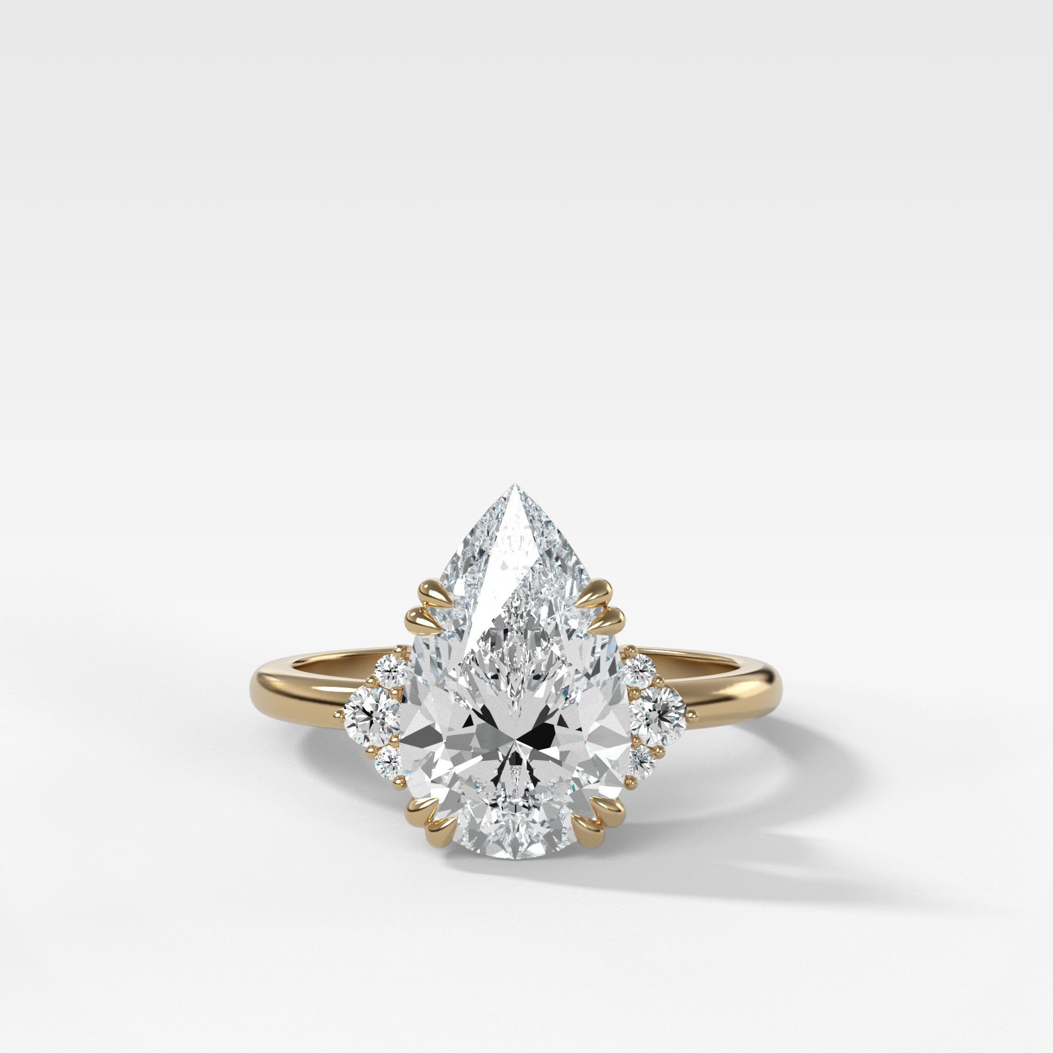 Signature Cluster Engagement Ring With Pear Cut Diamond